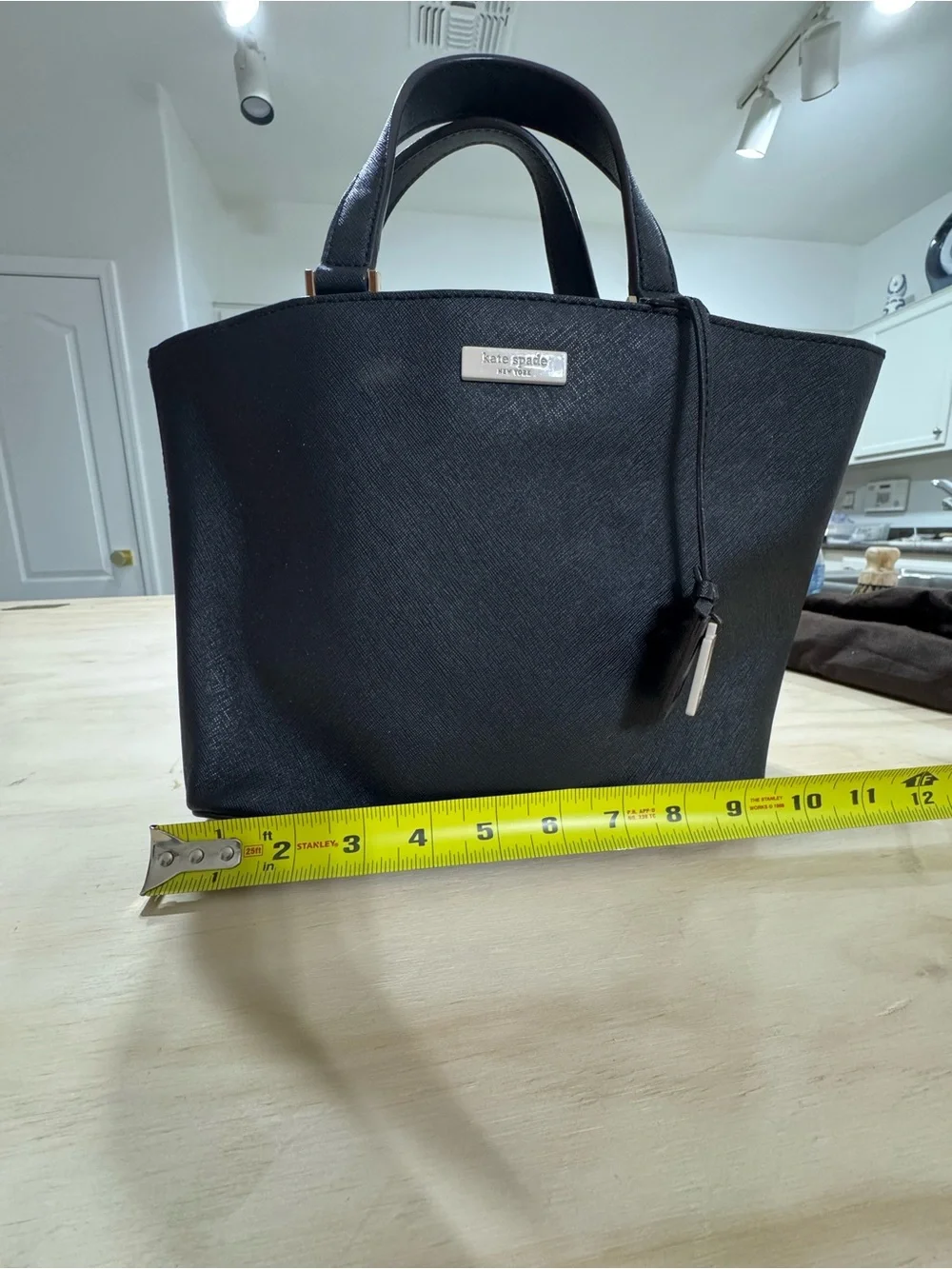 kate spade black saffiano tote with gold accents